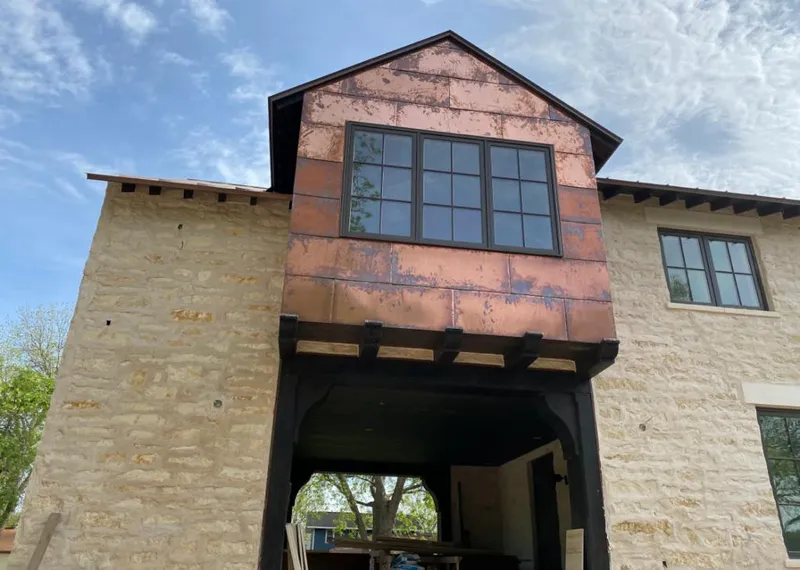 Copper metal panel facade on a stone building for Metal Roof Coating in Monaca